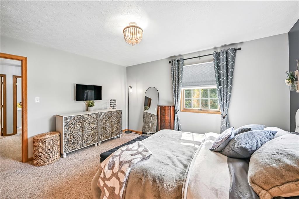 723 Rollinson Road Hermitage, PA 16148 - Photo 29 of 38 a bedroom with furniture and a flat screen tv