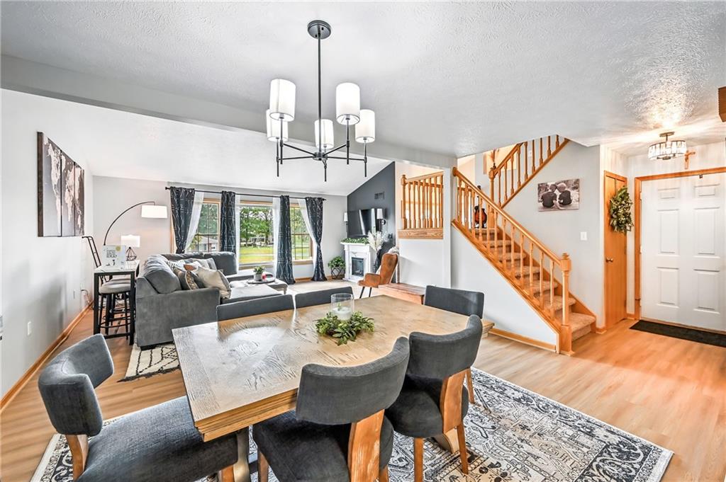 723 Rollinson Road Hermitage, PA 16148 - Photo 3 of 38 a view of a dining room and livingroom with furniture wooden floor a chandelier