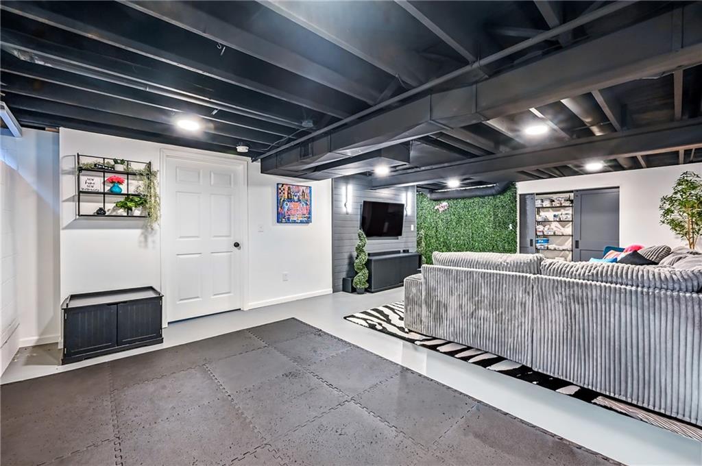 723 Rollinson Road Hermitage, PA 16148 - Photo 31 of 38 a living room with furniture and a flat screen tv