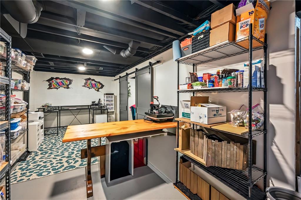 723 Rollinson Road Hermitage, PA 16148 - Photo 36 of 38 a utility room with stainless steel appliances kitchen island granite countertop a sink and cabinets