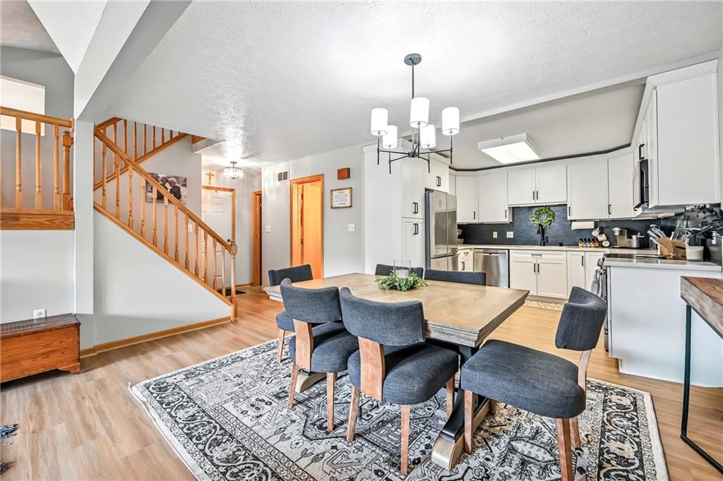 723 Rollinson Road Hermitage, PA 16148 - Photo 4 of 38 a view of a dining room with furniture and wooden floor