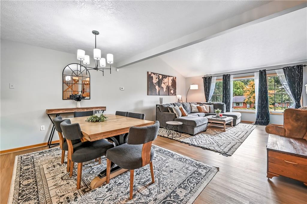 723 Rollinson Road Hermitage, PA 16148 - Photo 5 of 38 a living room with fireplace furniture and a chandelier