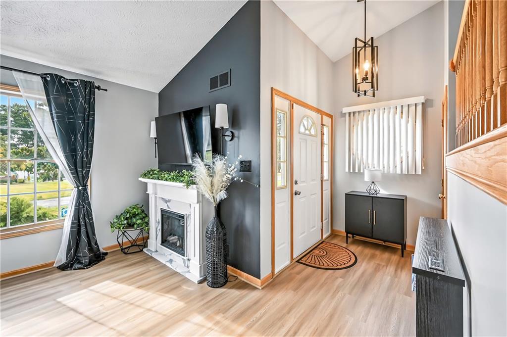 723 Rollinson Road Hermitage, PA 16148 - Photo 6 of 38 a view of a livingroom with furniture and a fireplace