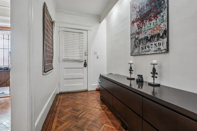 a room with a bench and cabinets
