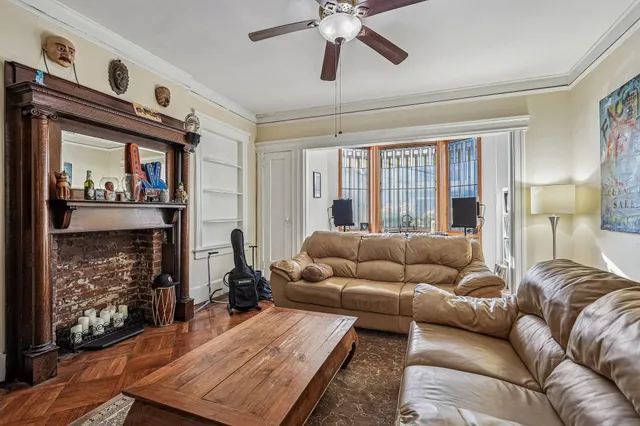 a living room with furniture and a fireplace