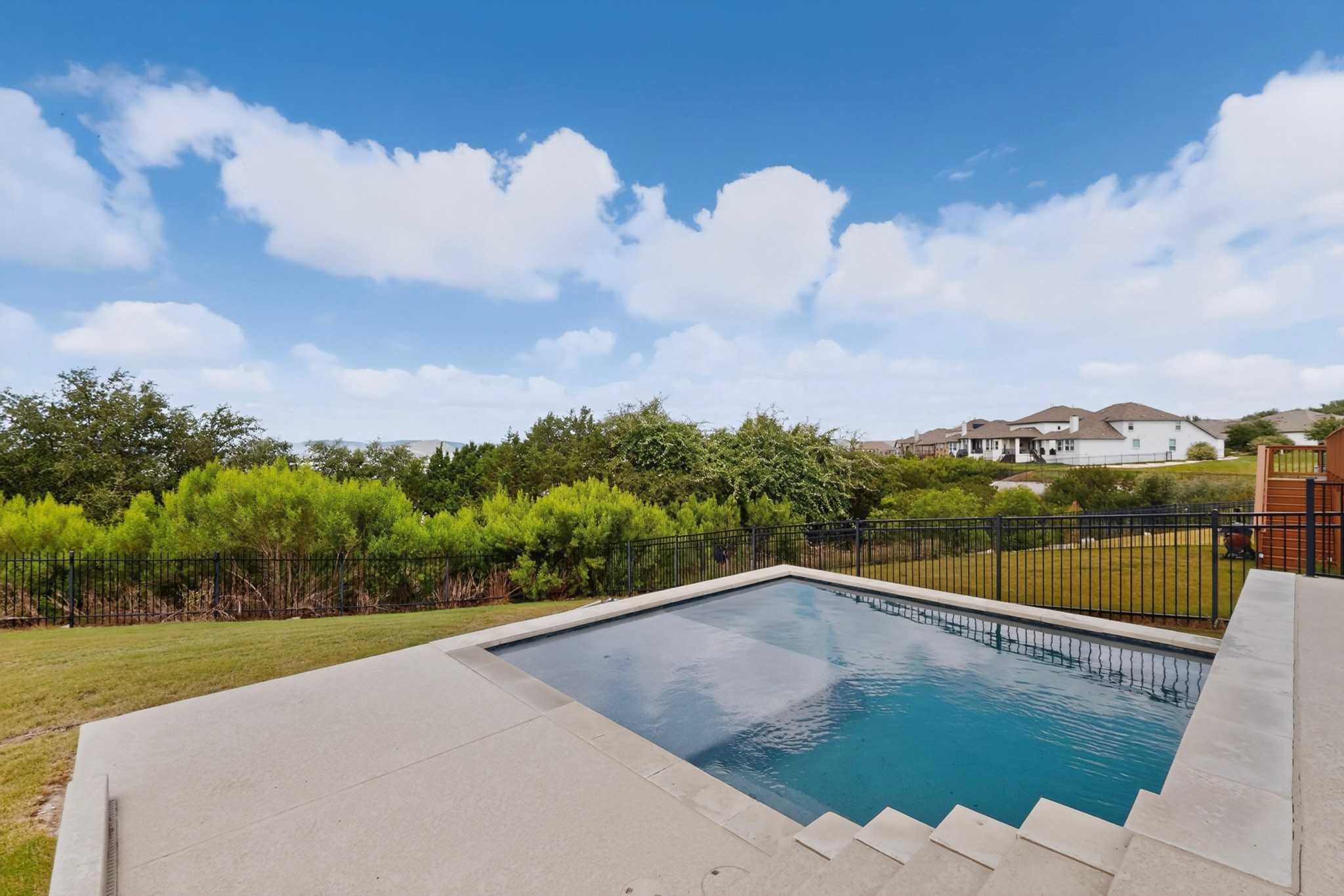 2617 Milan Meadows Drive Leander, TX 78641 - Photo 32 of 40 A private in-ground pool beckons with tranquil water and a scenic, verdant backdrop.