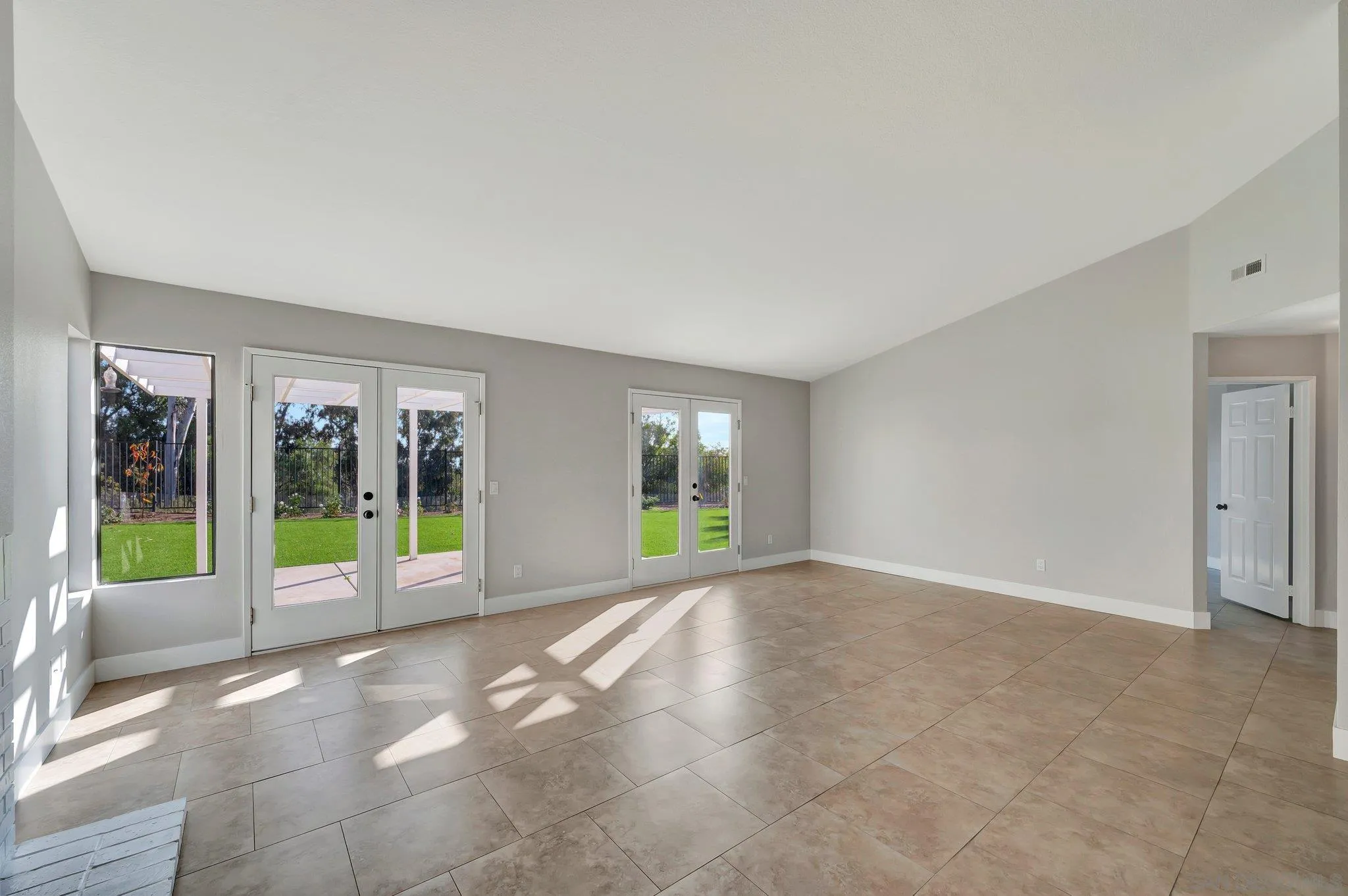 365 Apollo Drive Vista, CA 92084 - Photo 11 of 35 a view of a big room with windows and yard