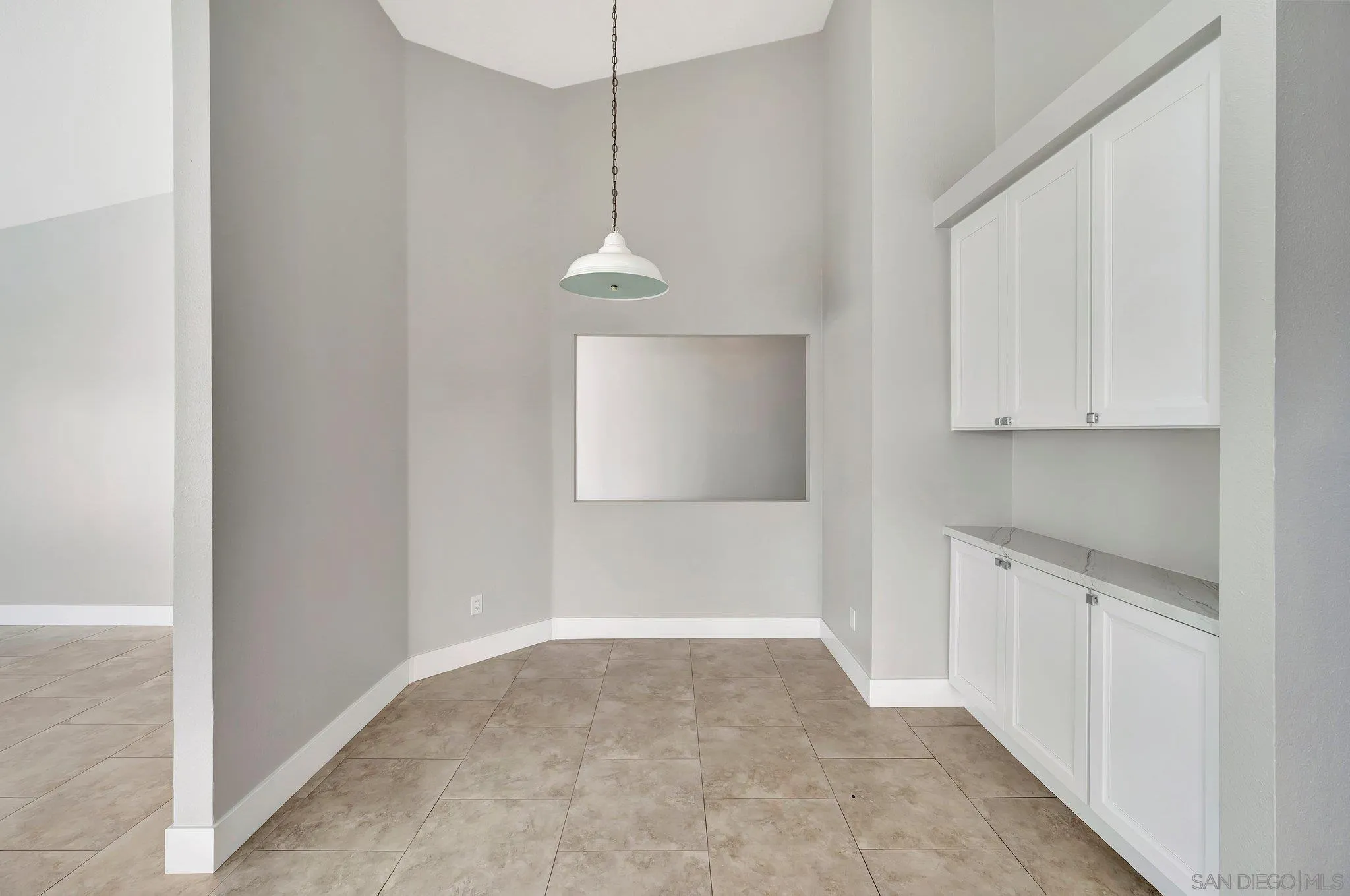 365 Apollo Drive Vista, CA 92084 - Photo 13 of 35 a view of a kitchen with white cabinets