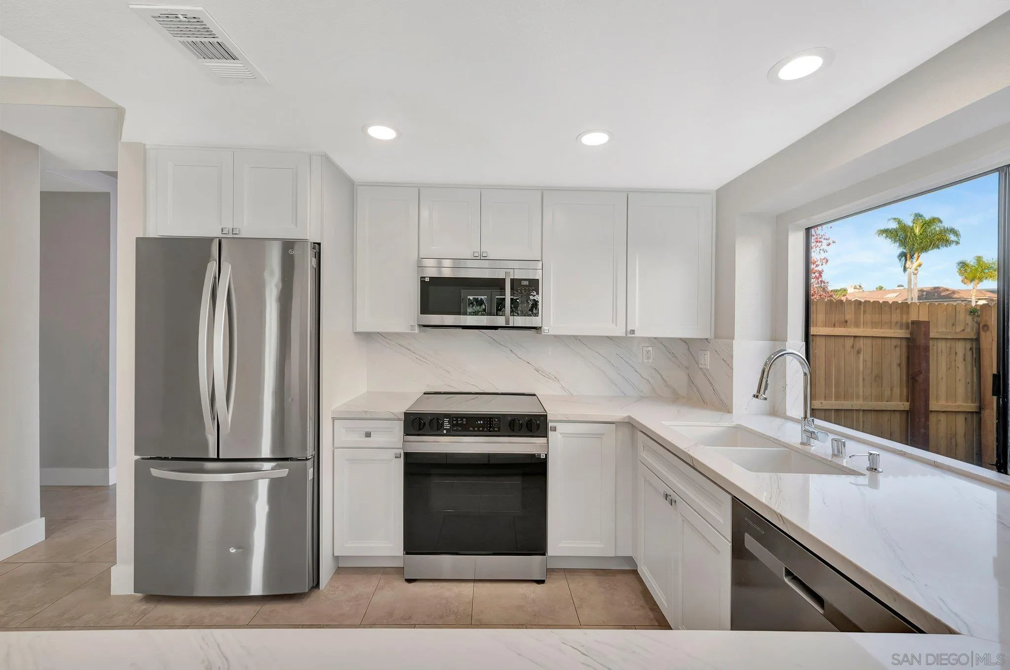 365 Apollo Drive Vista, CA 92084 - Photo 16 of 35 a kitchen with a refrigerator sink and stove