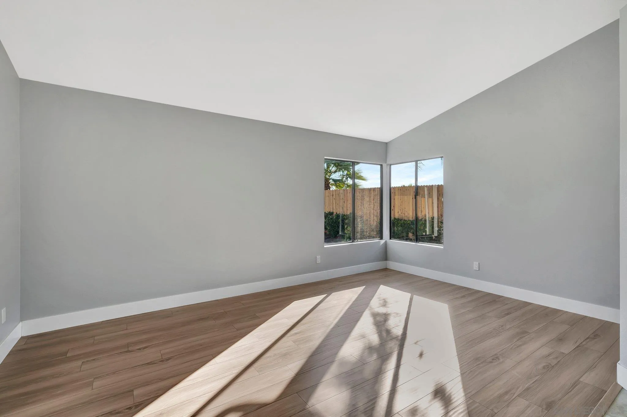365 Apollo Drive Vista, CA 92084 - Photo 17 of 35 wooden floor in an empty room with a window