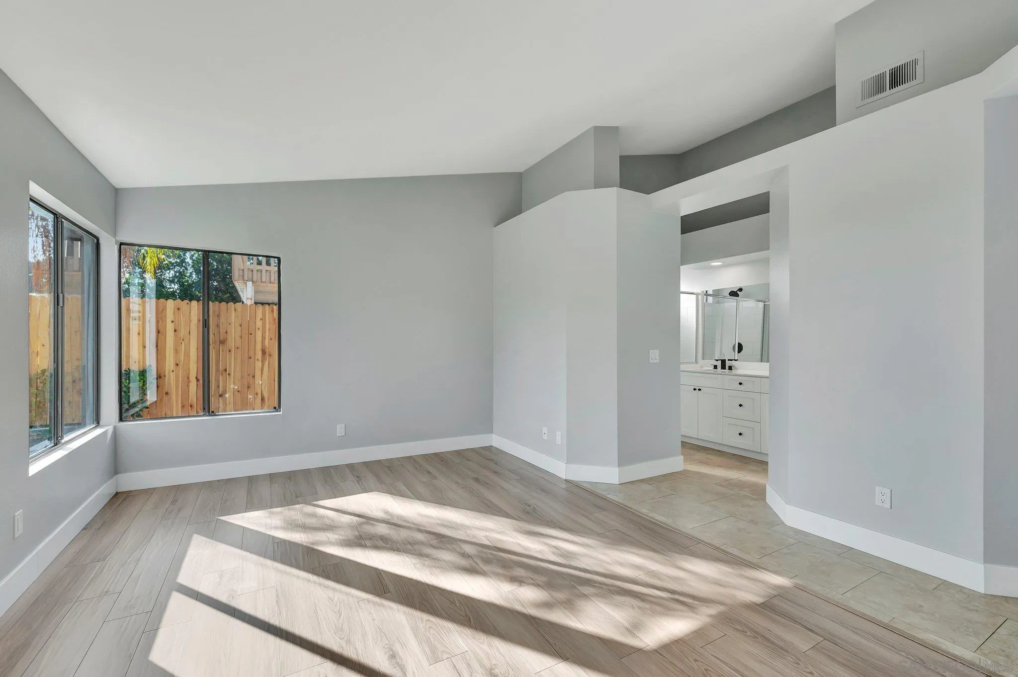 365 Apollo Drive Vista, CA 92084 - Photo 19 of 35 a view of a livingroom with wooden floor and windows