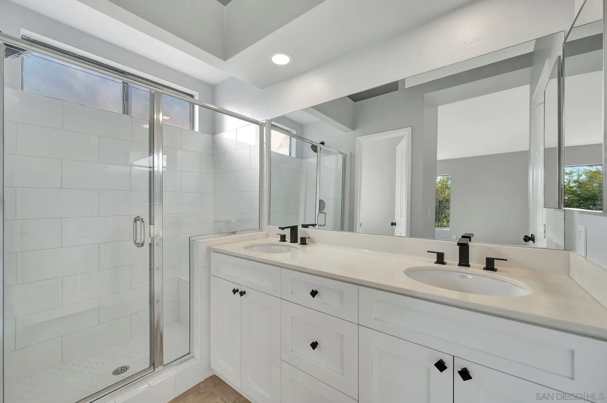 365 Apollo Drive Vista, CA 92084 - Photo 20 of 35 a bathroom with a double vanity sink mirror and shower