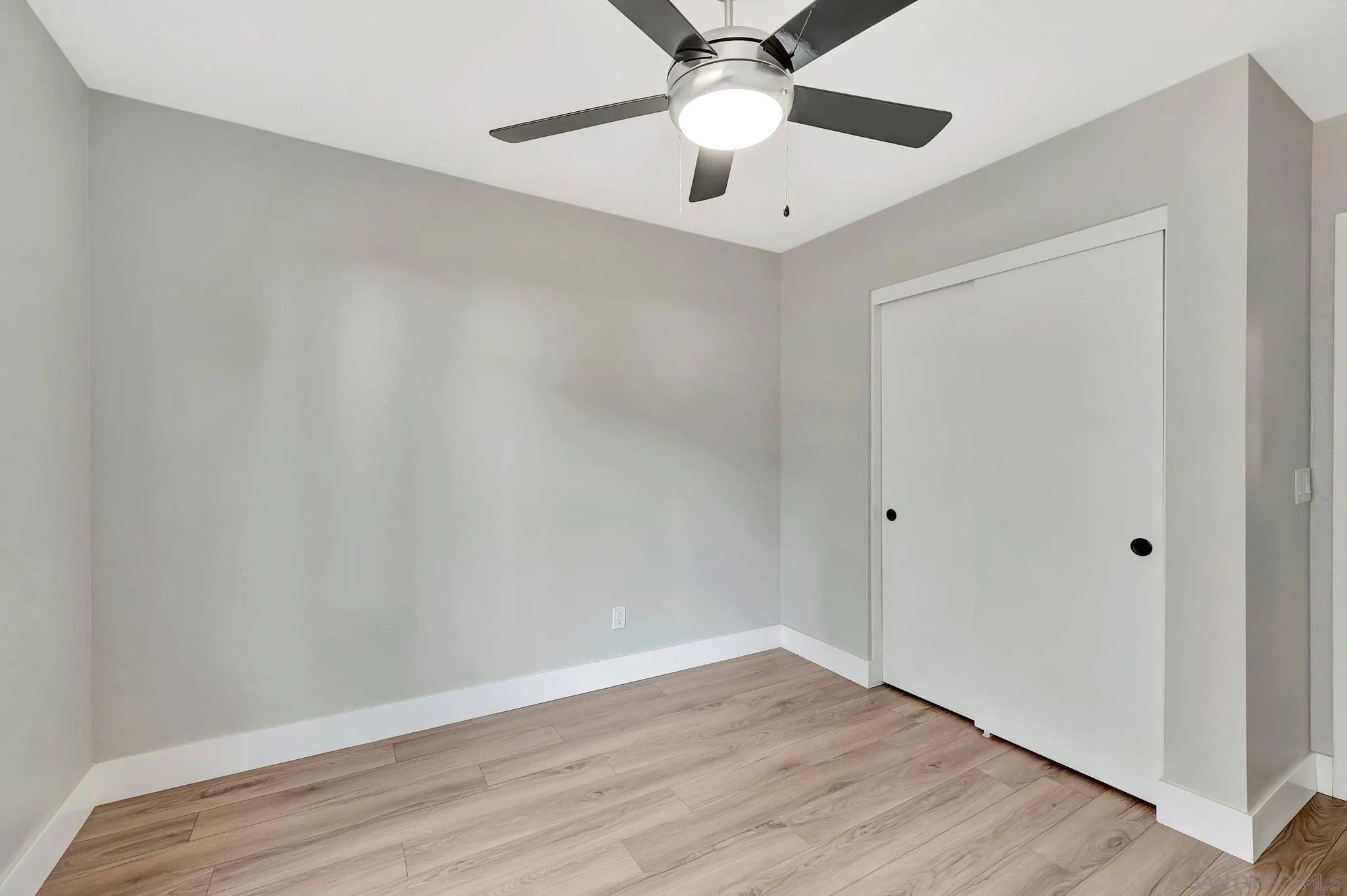 365 Apollo Drive Vista, CA 92084 - Photo 22 of 35 a view of an empty room with wooden floor