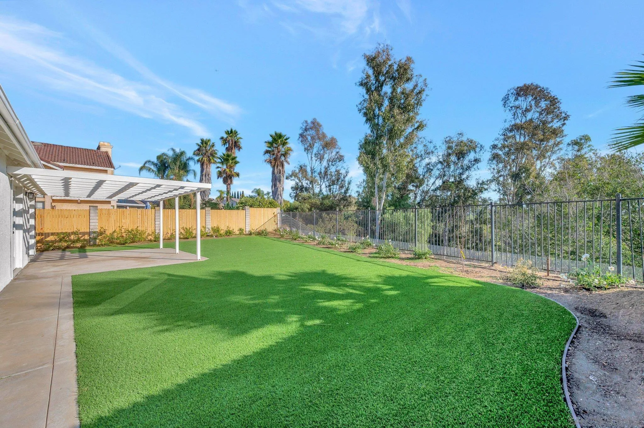 365 Apollo Drive Vista, CA 92084 - Photo 30 of 35 a view of a house with a yard and a patio