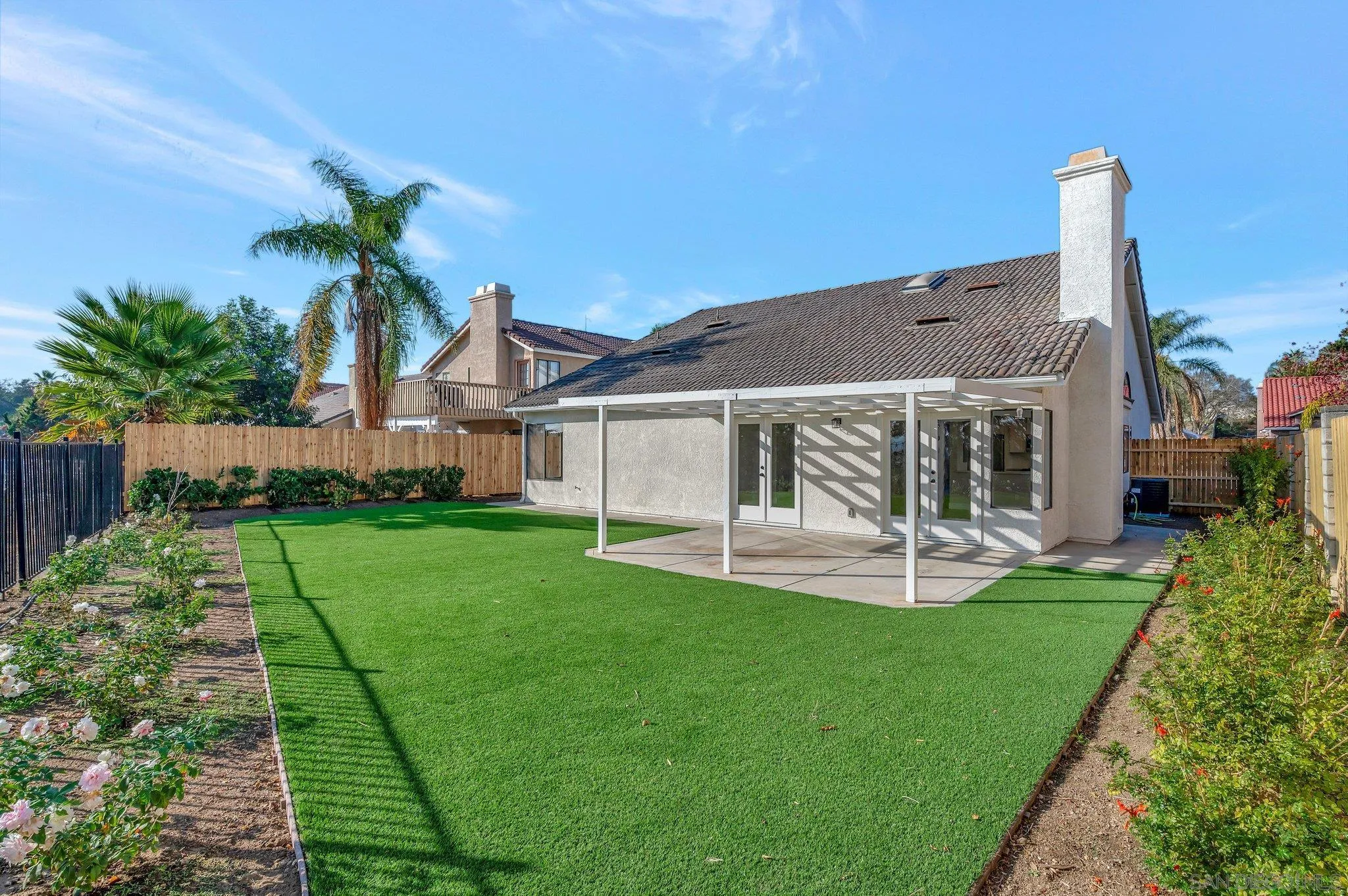 365 Apollo Drive Vista, CA 92084 - Photo 32 of 35 a front view of a house with a yard and porch