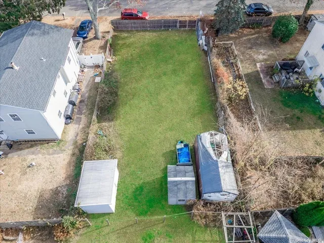 an aerial view of a house with outdoor space