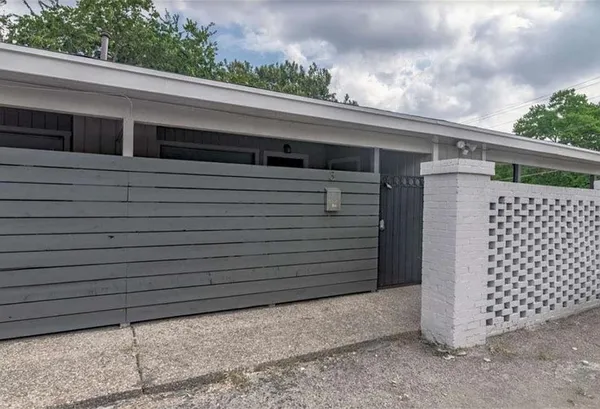 a side view of a house with a garage