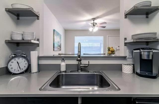 1915 Fairlawn Lane, Unit 2 Austin, TX 78704 - Photo 6 of 12 Kitchen with open shelves and ceiling fan