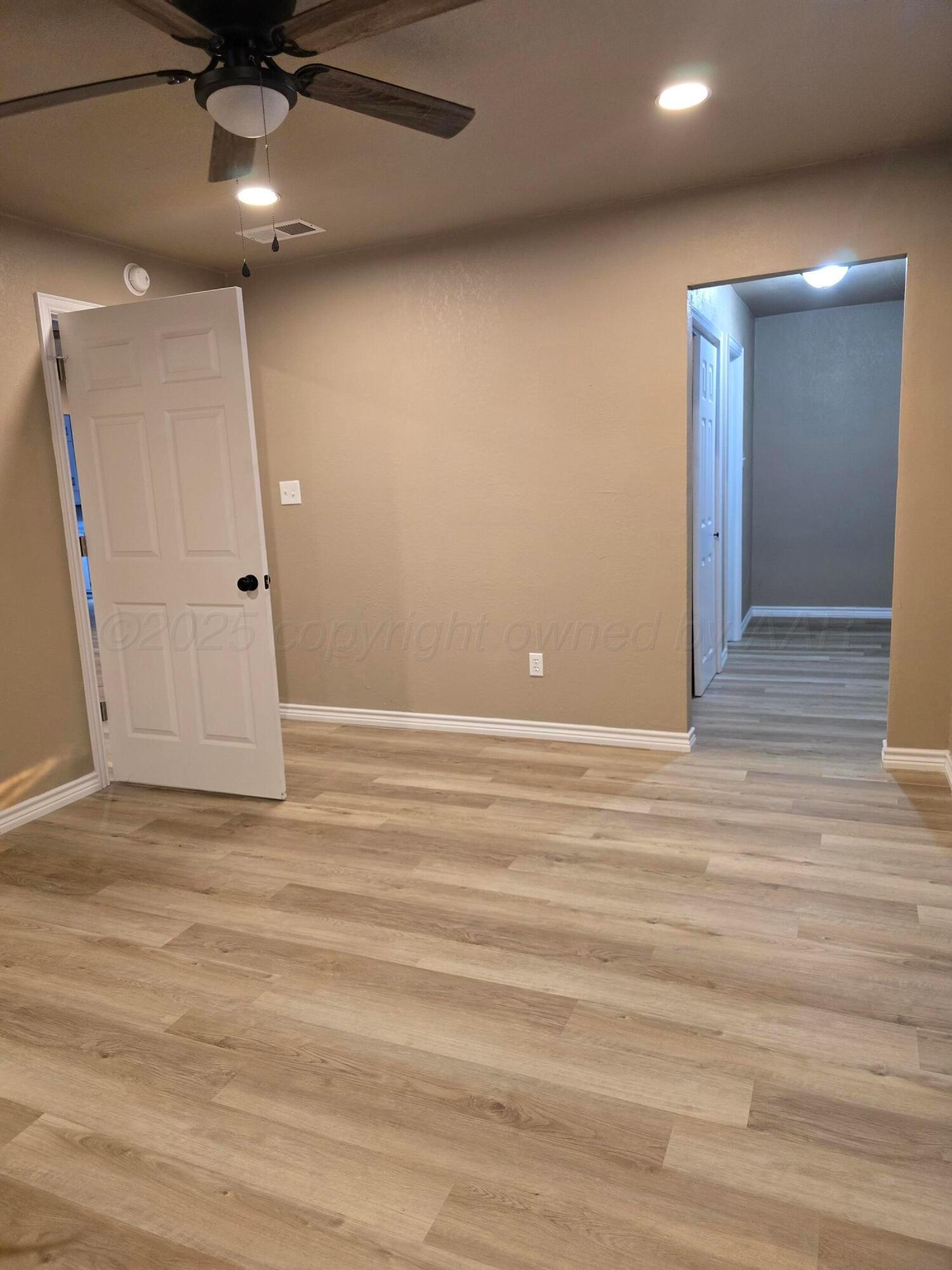 129 Pecan Street Borger, TX 79007 - Photo 13 of 23 a view of an empty room with a window