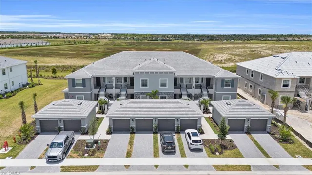 an aerial view of a house with a ocean view