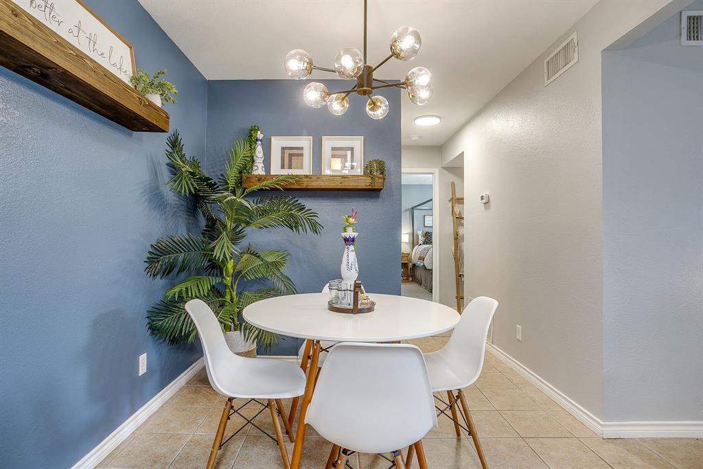 3063 Hells Gate Loop, Unit 23 Strawn, TX 76475 - Photo 11 of 20 a dining room with furniture and window