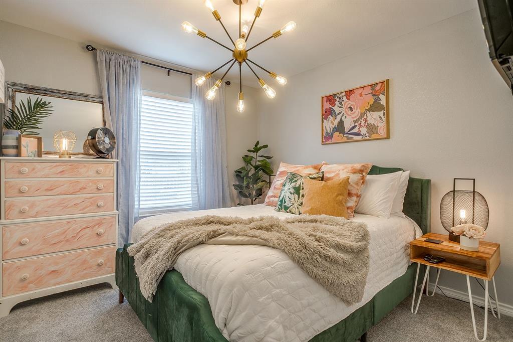 3063 Hells Gate Loop, Unit 23 Strawn, TX 76475 - Photo 15 of 20 a bedroom with a bed and a dresser