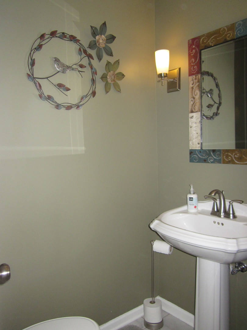 26W564 Jewell Road Winfield, IL 60190 - Photo 14 of 40 a bathroom with a sink a toilet and mirror