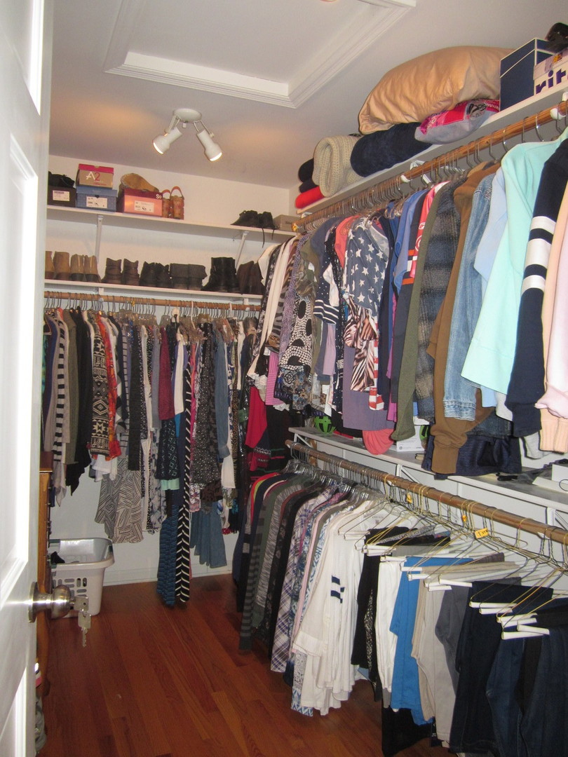 26W564 Jewell Road Winfield, IL 60190 - Photo 19 of 40 a view of walk in closet with clothes and shoes
