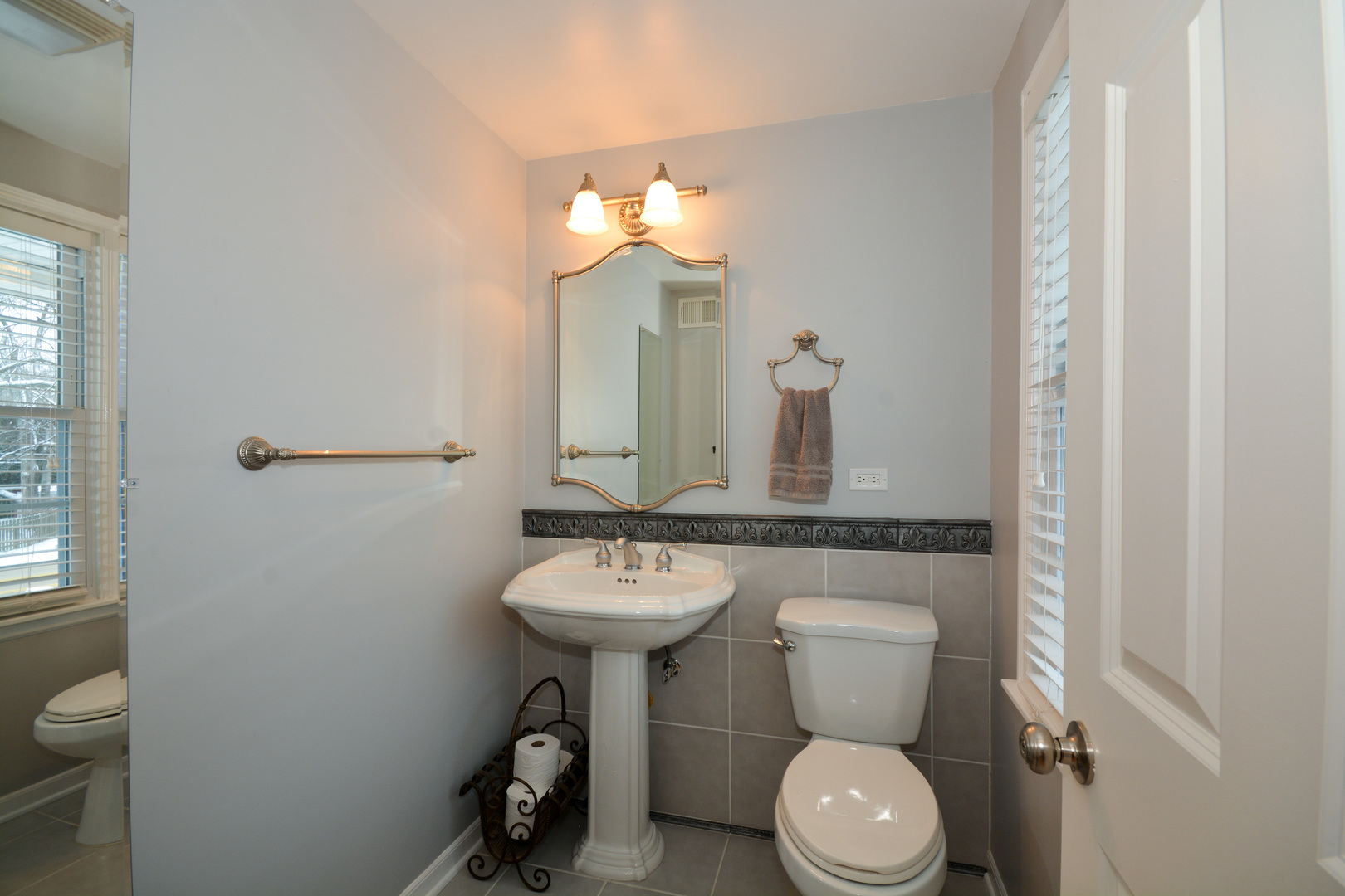 26W564 Jewell Road Winfield, IL 60190 - Photo 22 of 40 a bathroom with a toilet sink and mirror
