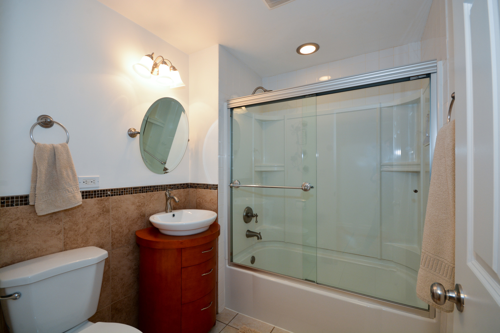 26W564 Jewell Road Winfield, IL 60190 - Photo 28 of 40 a bathroom with a granite countertop sink a toilet and shower