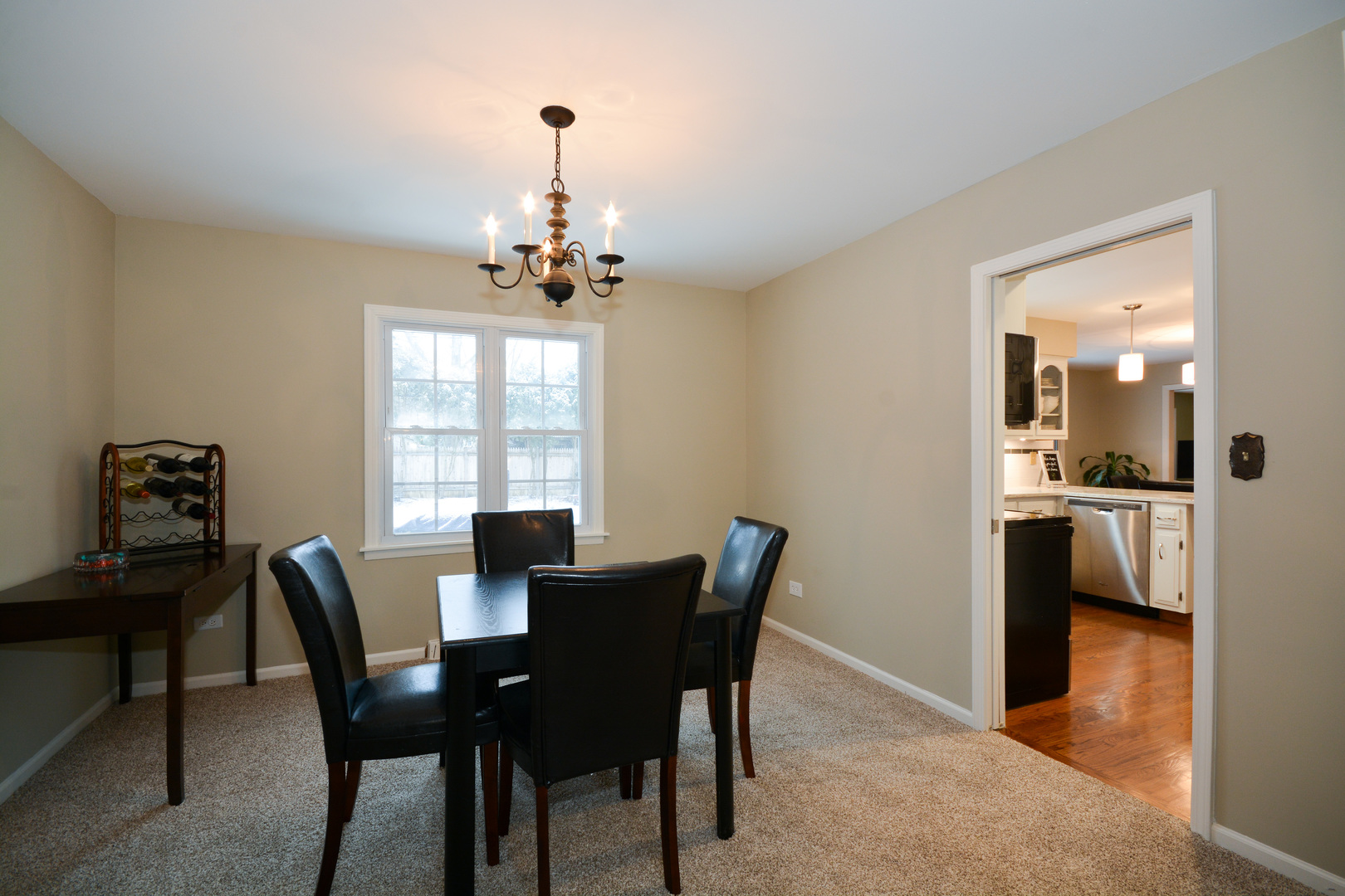 26W564 Jewell Road Winfield, IL 60190 - Photo 4 of 40 a view of a dining room with furniture and a chandelier
