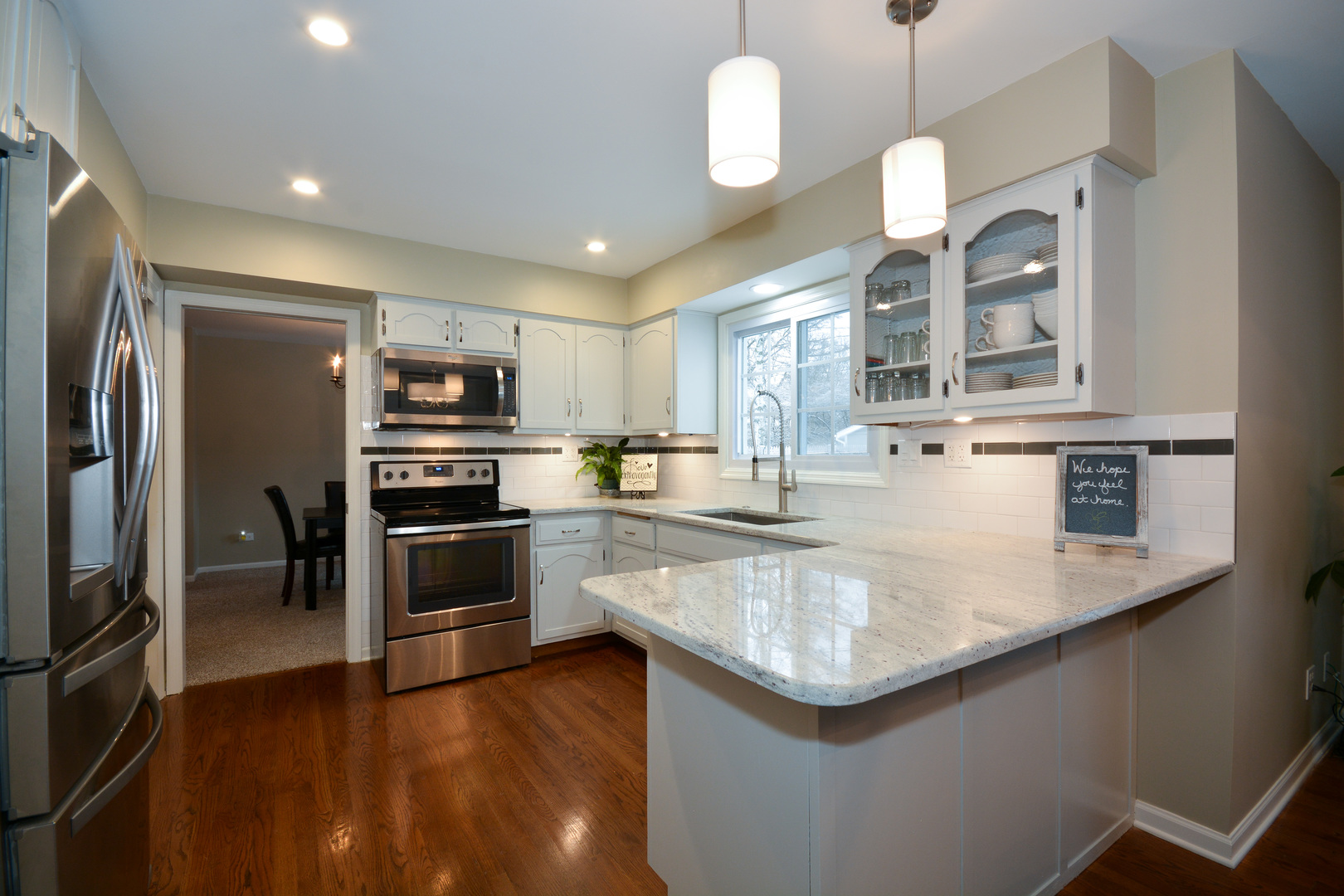 26W564 Jewell Road Winfield, IL 60190 - Photo 5 of 40 a kitchen with stainless steel appliances granite countertop a sink a stove and a refrigerator