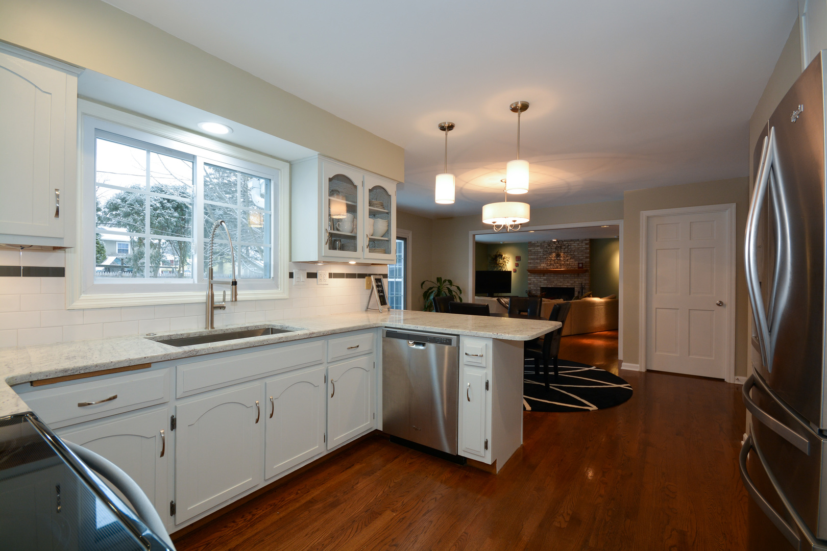 26W564 Jewell Road Winfield, IL 60190 - Photo 6 of 40 a kitchen with sink cabinets and wooden floor