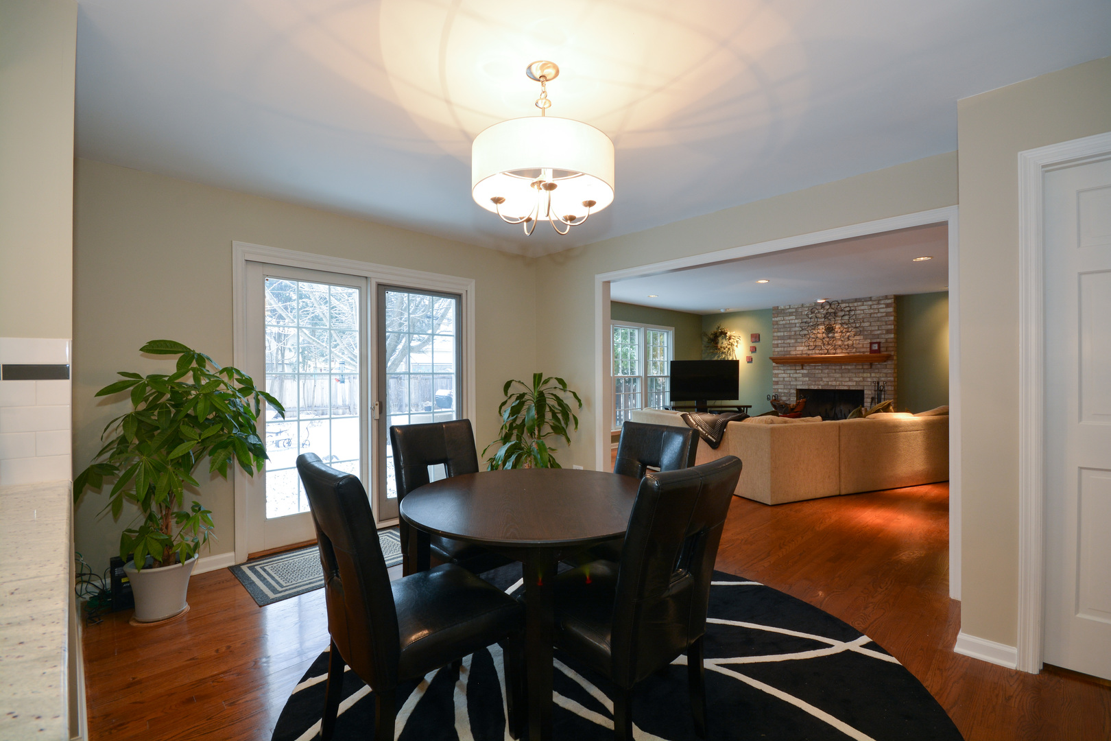 26W564 Jewell Road Winfield, IL 60190 - Photo 8 of 40 a view of a dining room with furniture window and wooden floor