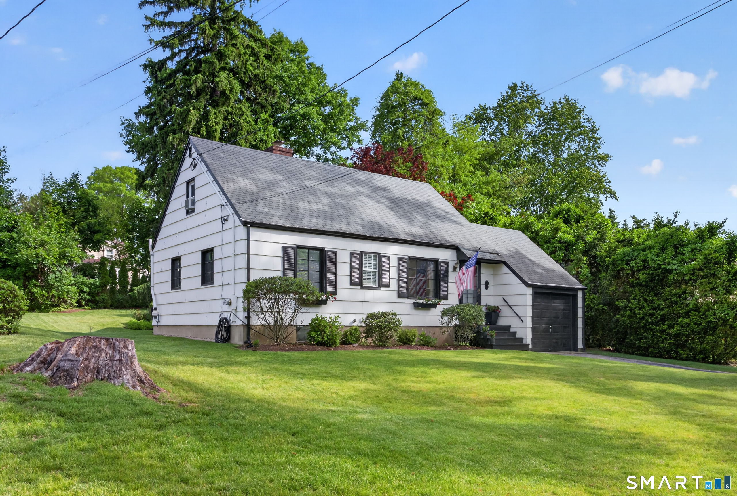 68 Old Elm Road Fairfield, CT 06825 - Photo 4 of 40 a aerial view of a house with a yard table and chairs