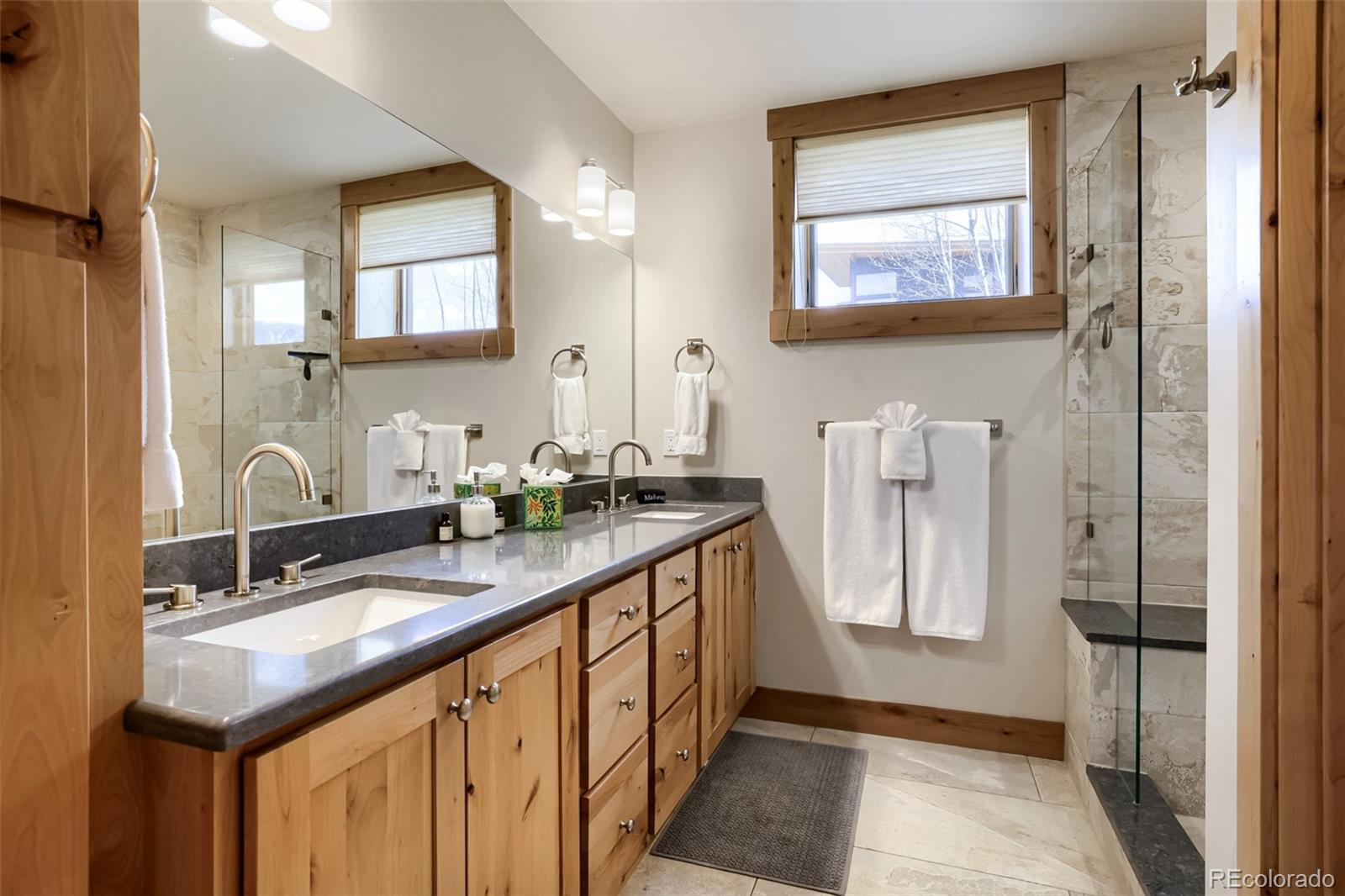836 Maryland Creek Road Silverthorne, CO 80498 - Photo 12 of 49 a bathroom with double sink and two mirror