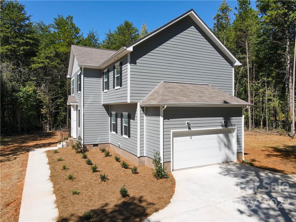 4960 Long Ferry Road Salisbury, NC 28146 - Photo 11 of 14 a front view of a house with a yard and garage