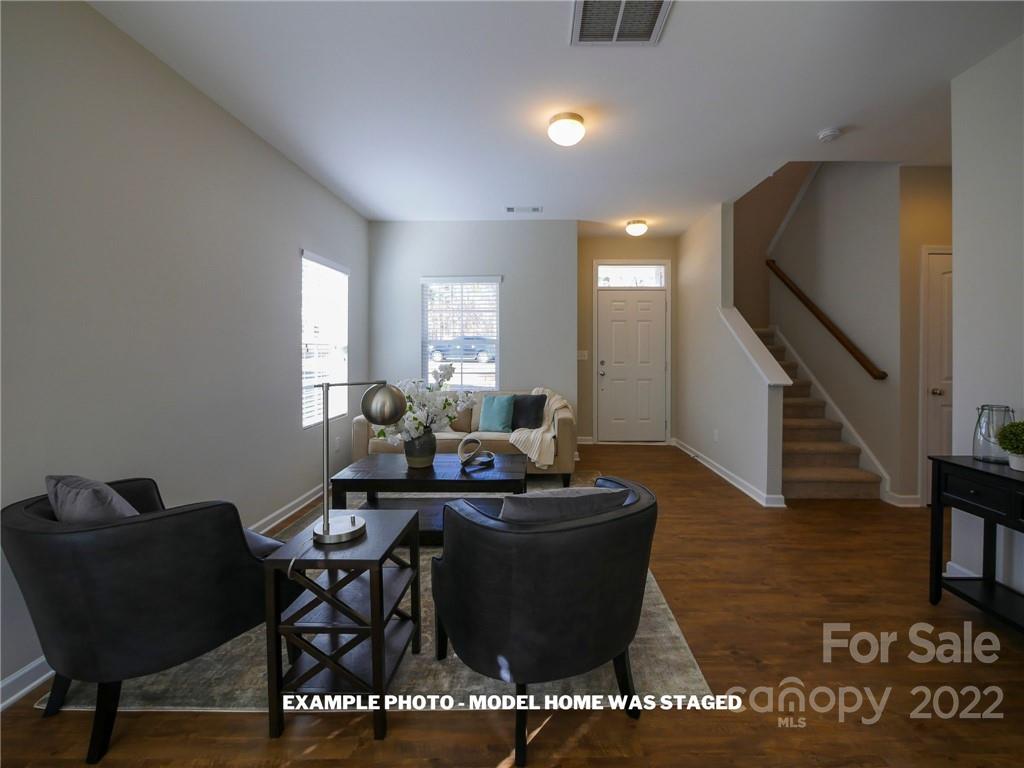 4960 Long Ferry Road Salisbury, NC 28146 - Photo 2 of 14 a living room with couches chairs and a coffee table