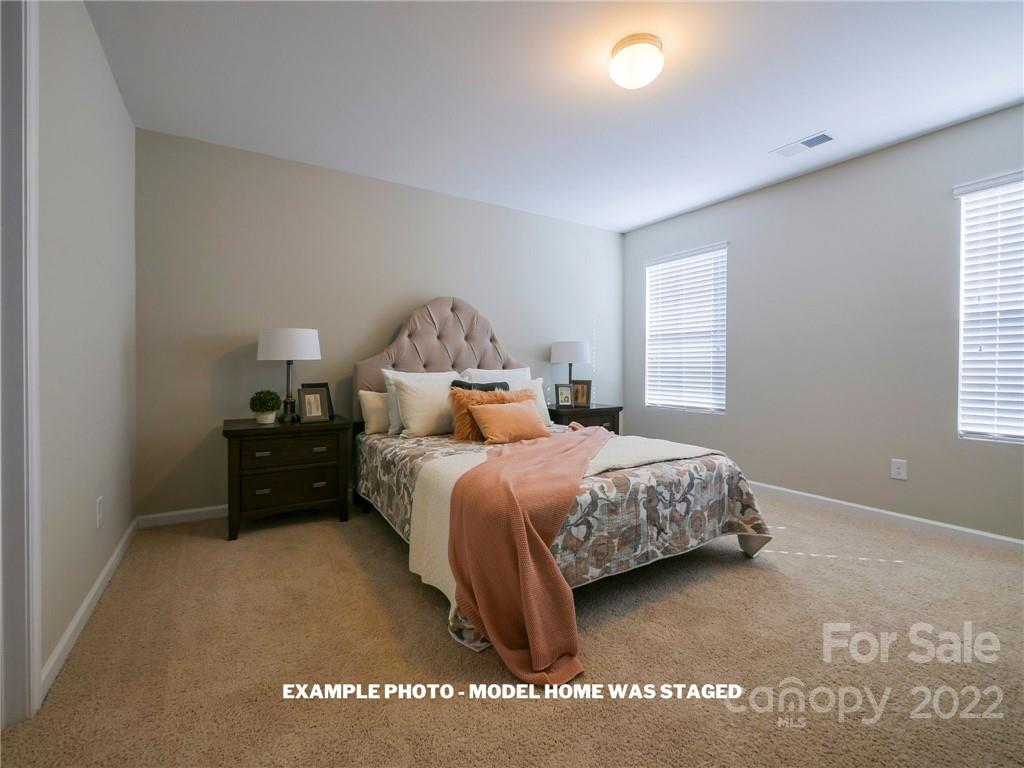 4960 Long Ferry Road Salisbury, NC 28146 - Photo 6 of 14 a bedroom with a bed and a large window