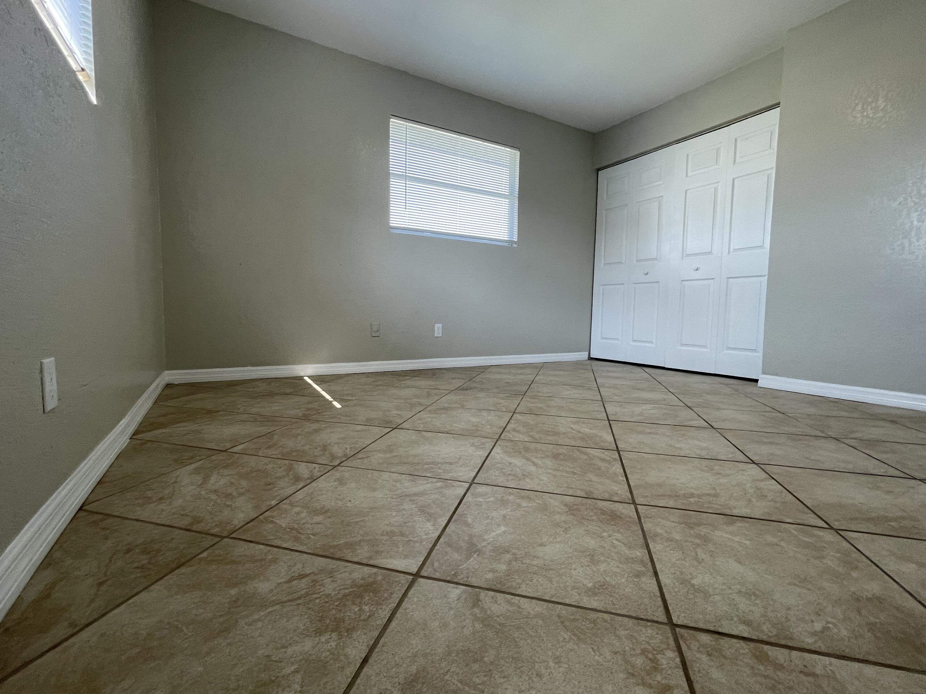 2880 Harson Way Fort Pierce, FL 34946 - Photo 28 of 40 a view of an empty room with a window