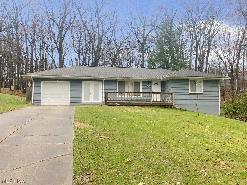 4953 Stevens Road Akron, OH 44319 - Photo 1 of 14 Ranch-style home featuring a front lawn and a garage