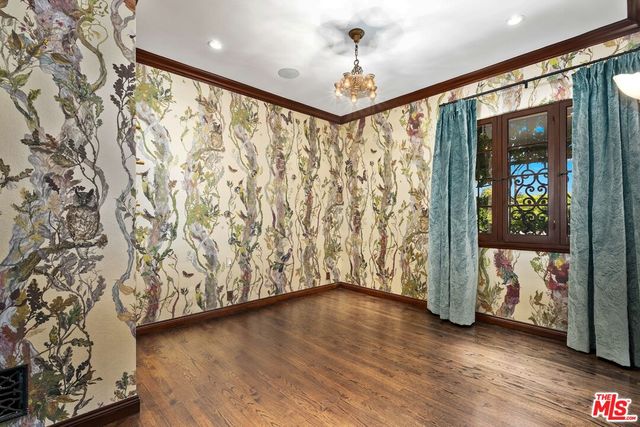 a spacious bathroom with a sink and mirror