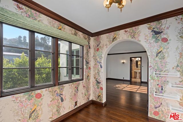 a view of an entryway with wooden floor