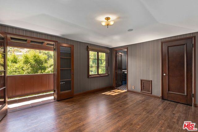 a living room with furniture a fireplace and a potted plant