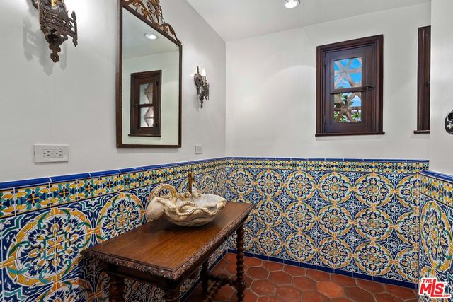 a picture of a bathroom with a shower and a sink