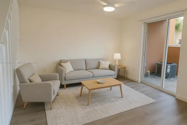 a living room with furniture and a rug