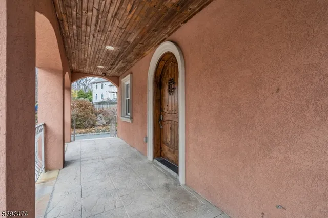 a view of a entryway door with wooden floor
