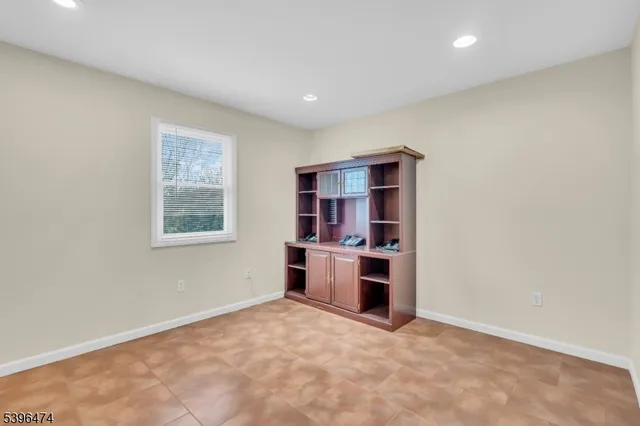 a view of a kitchen with a sink and a window