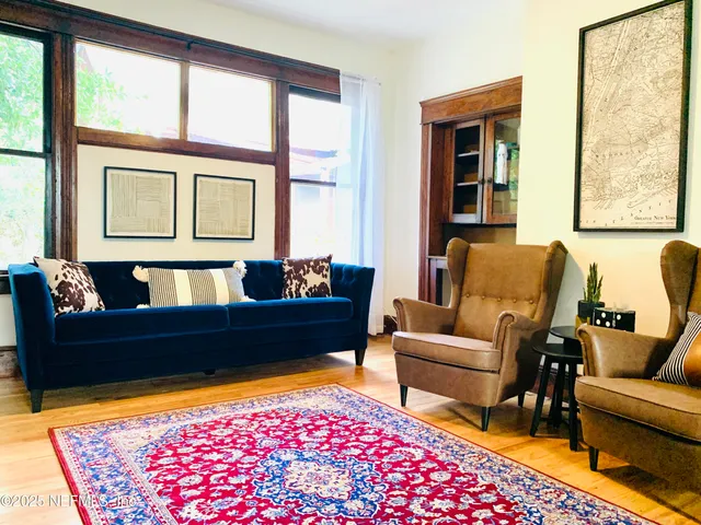 a living room with furniture and a rug