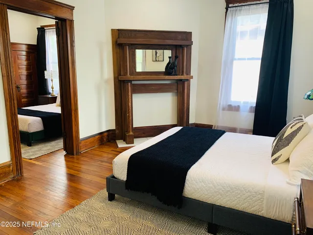 a bedroom with a bed and window